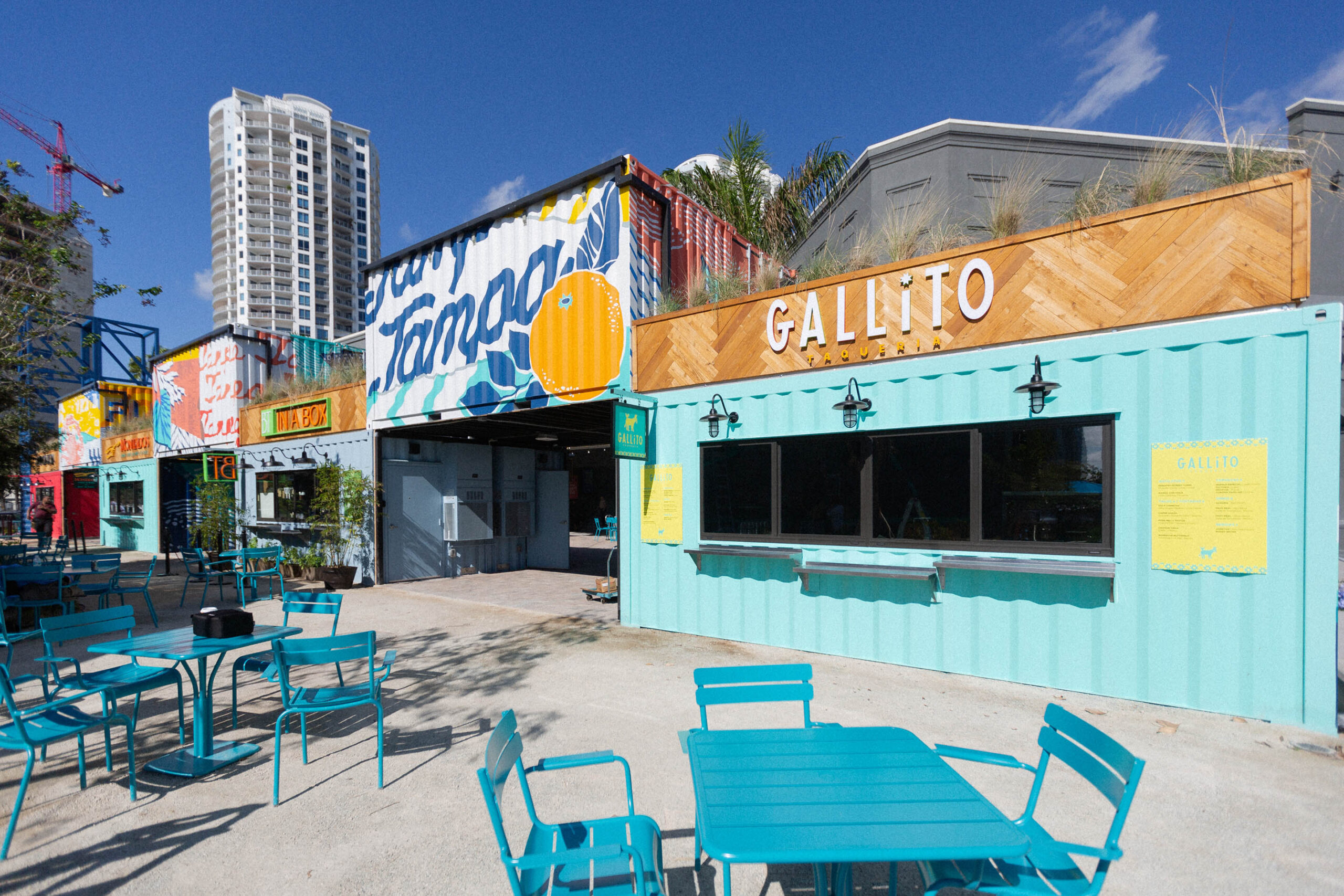 Painted shipping container restaurants at Sparkman Wharf, Tampa, with the Gallito storefront