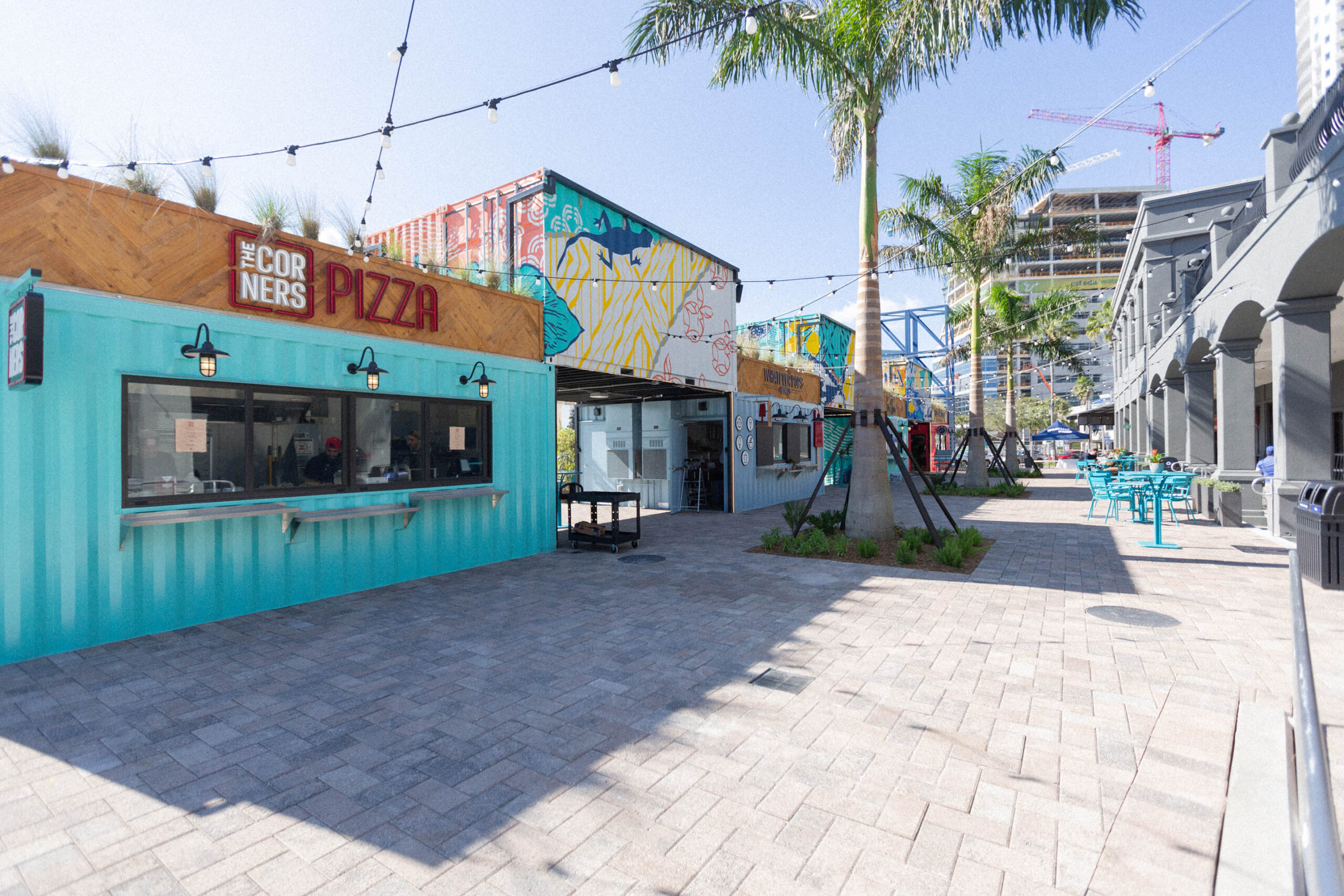 Shipping container murals and outdoor seating at Sparkman Wharf, Tampa